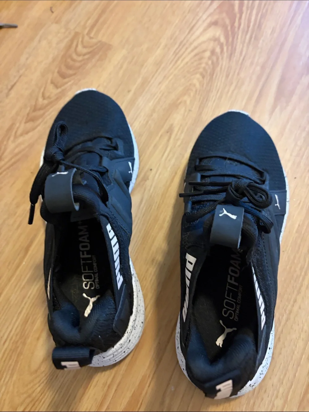 Puma women’s Black Athletic Sneakers with White Accent